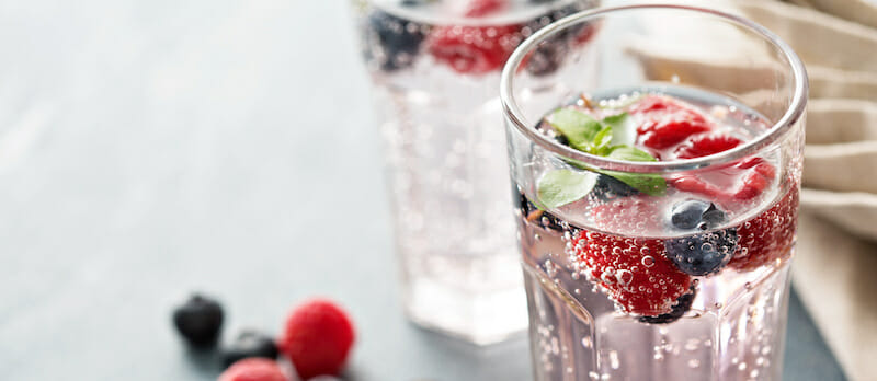 Sparkling water with raspberries and blueberries